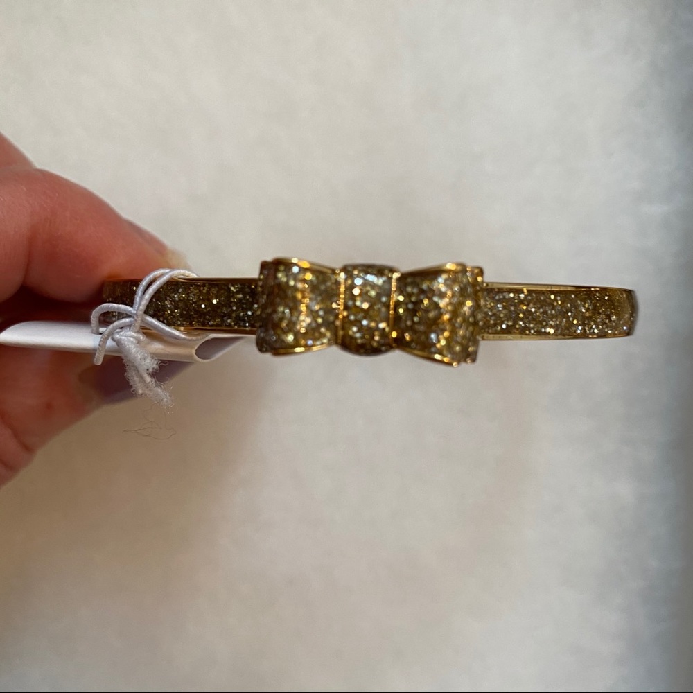 KATE SPADE NEW NWT BRACELET BANGLE GOLD PLATE GLITTER BOW MOON RIVER JEWELRY - Picture 2 of 8